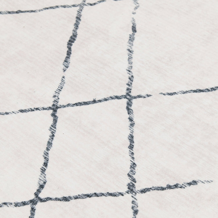 Selin Ivory Washable Area Rug - 5’ x 7’