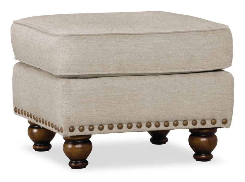 Made in Canada Wynn 24\" Chenille Fabric Ottoman with Nailhead Trim and Wood Bun Legs - Linen
